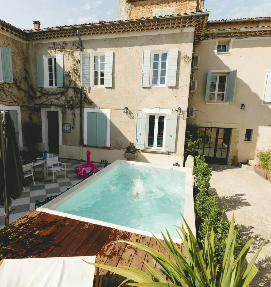 Stone manor house with a swimming pool in the courtyard