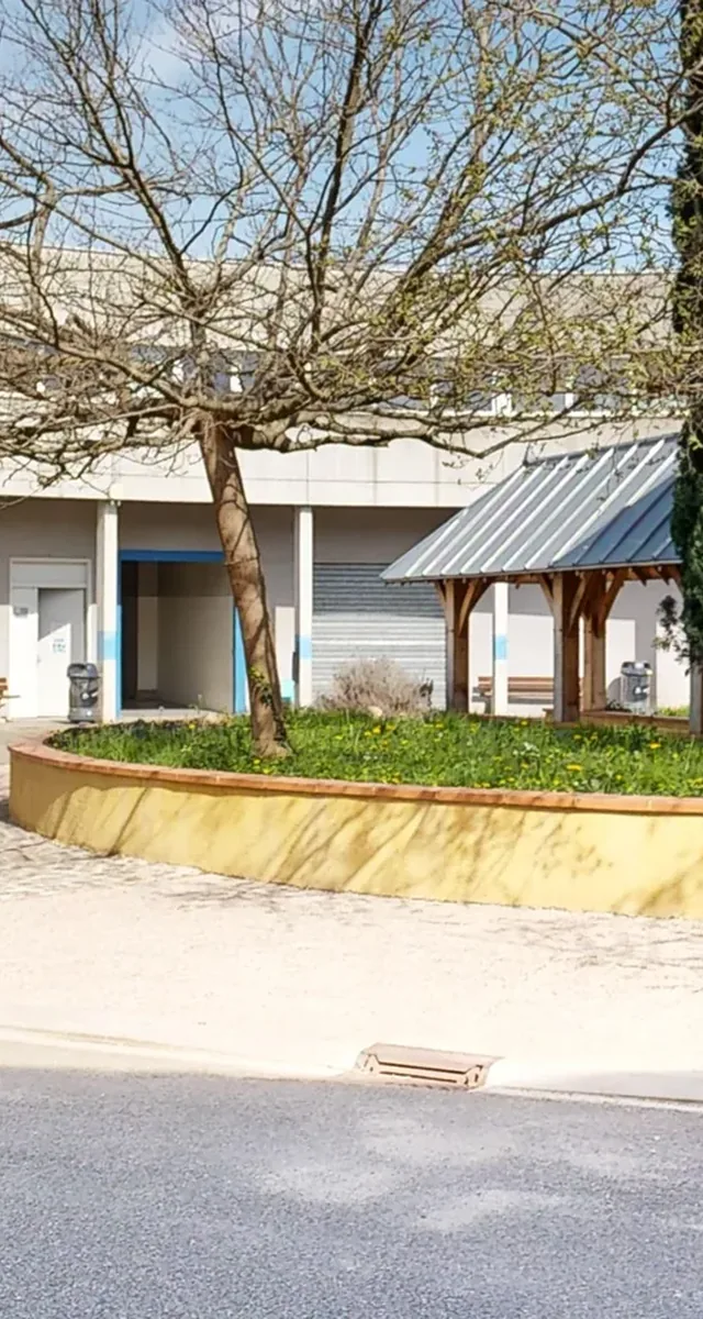 A public building and its tree-lined forecourt, tracked in the building health record