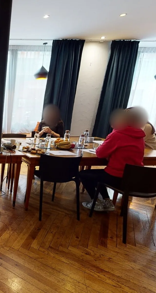Hotel seminar room, participants' faces blurred
