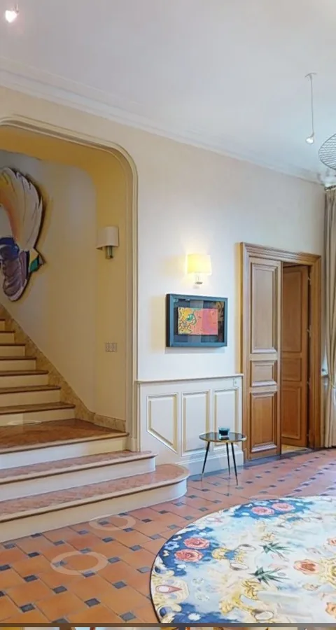 A château's grand staircase, a stop on the automatic guided tour