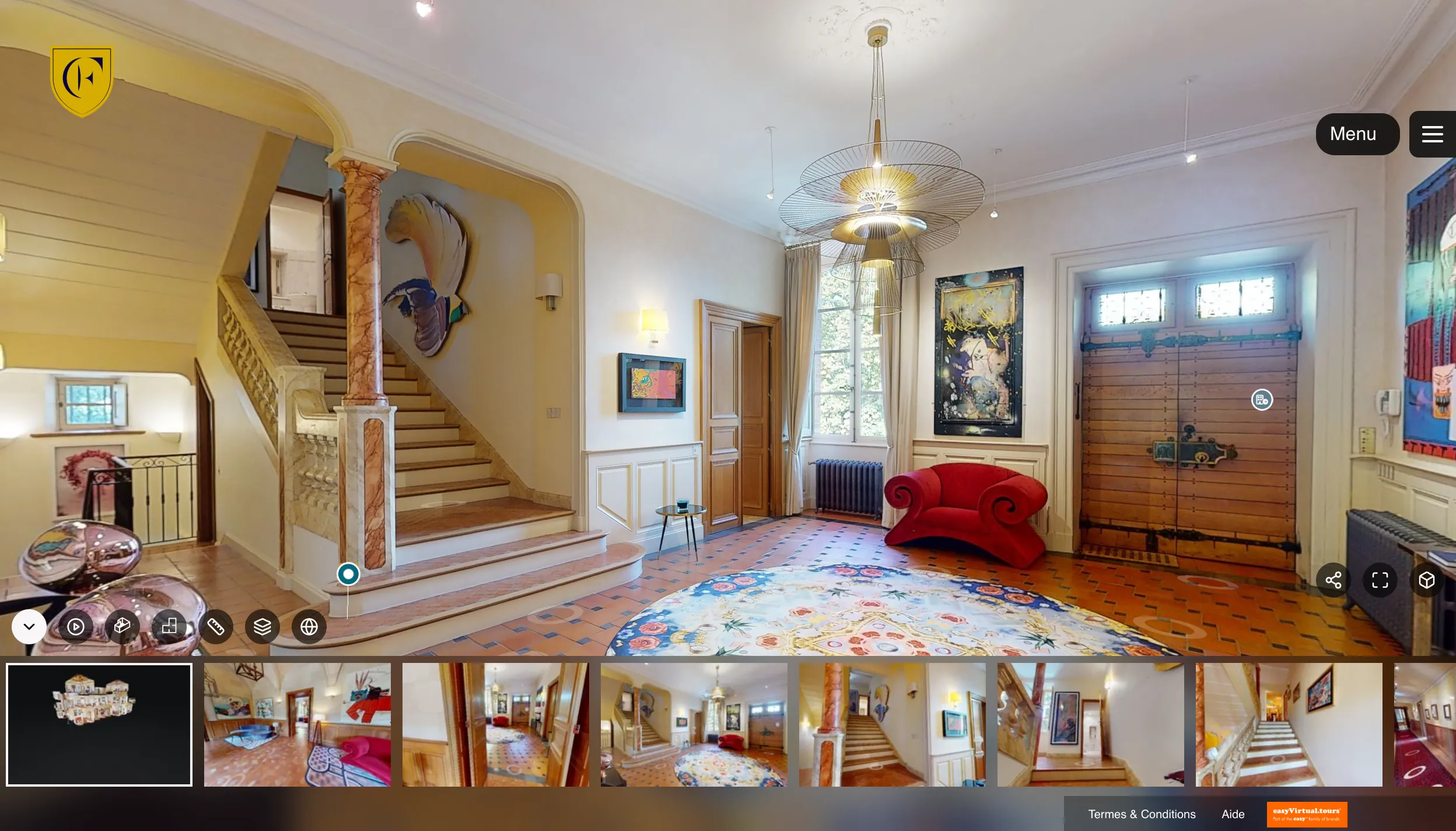 Automatic guided tour of the Château de Forbin on a tablet, paused on the entrance hall and the grand staircase, with the strip of stops along the bottom