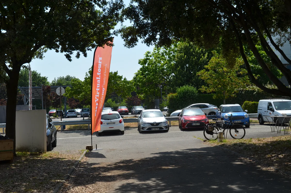 easyVirtual.tours flag in a business park car park