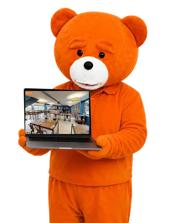 Ours easyVirtual.tours, la mascotte de la marque, qui montre une visite virtuelle sur un ordinateur portable
