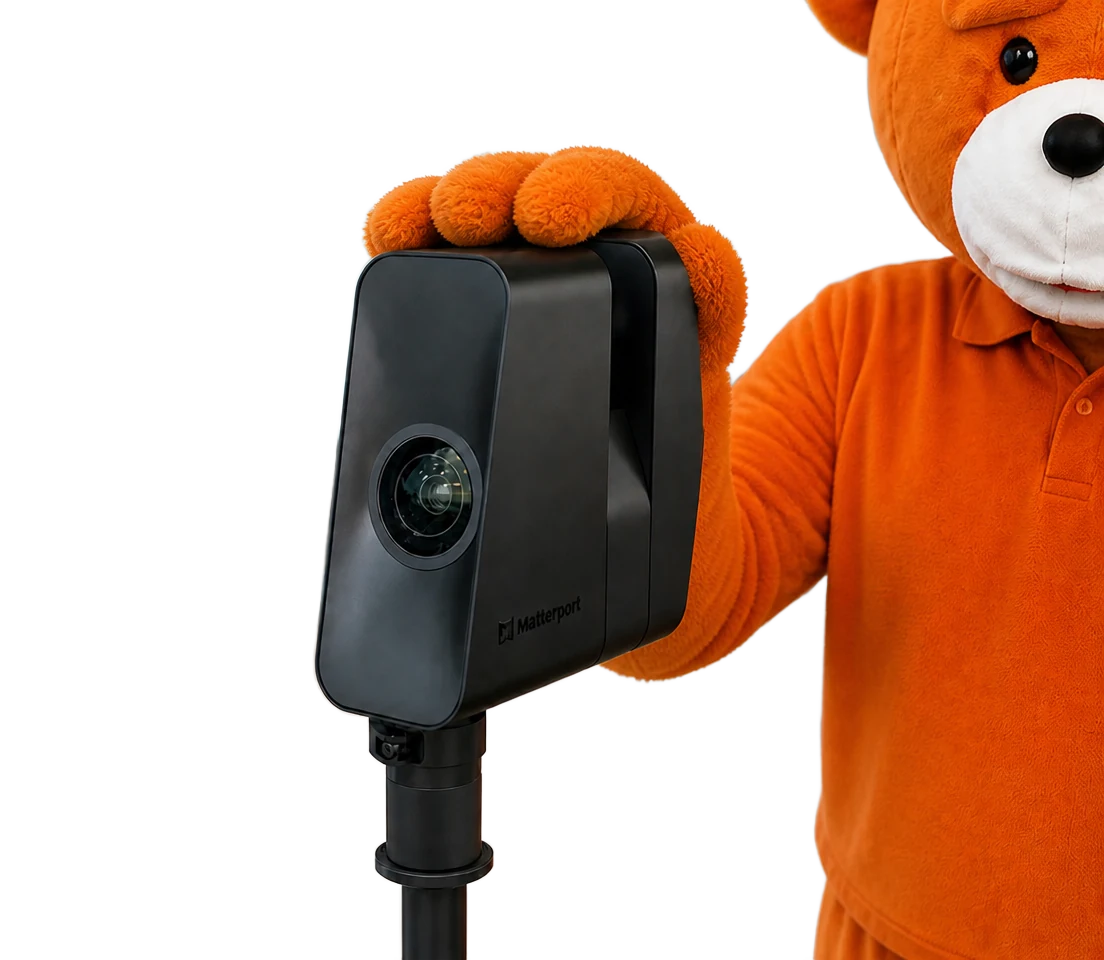 The easyVirtual.tours bear, the brand mascot, holding a Matterport Pro3 camera on its tripod